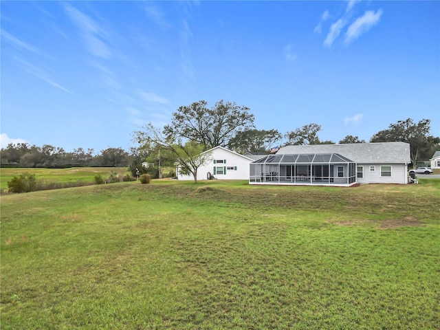 view of yard featuring glass enclosure