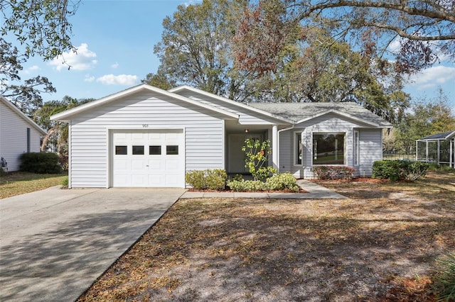 ranch-style home featuring a garage and driveway