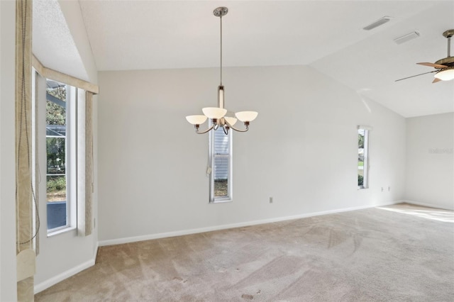 spare room featuring vaulted ceiling, carpet, and a wealth of natural light