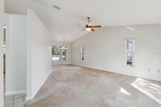 unfurnished living room with lofted ceiling, light carpet, ceiling fan with notable chandelier, visible vents, and baseboards