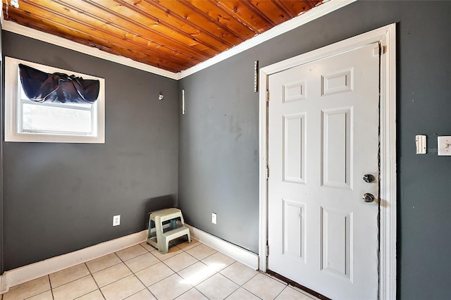 1301 N Shore Dr, Leesburg, FL 34748 - empty room featuring ornamental molding, wooden ceiling, baseboards, and light tile patterned floors