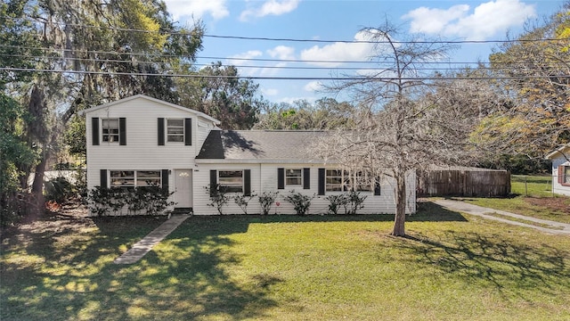 1301 N Shore Dr, Leesburg, FL 34748 - traditional-style house featuring a front yard and fence
