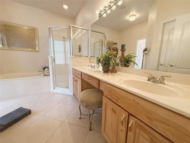 bathroom featuring a garden tub, tile patterned flooring, a sink, and a shower stall