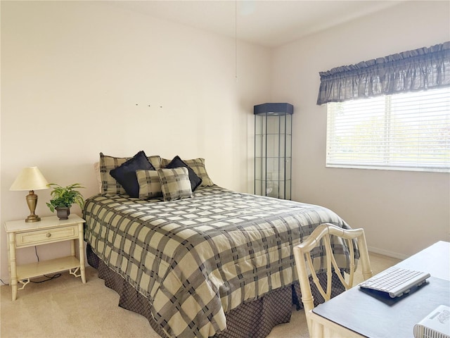 bedroom with light colored carpet