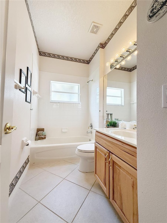 bathroom featuring shower / bathing tub combination, tile patterned flooring, visible vents, and a healthy amount of sunlight