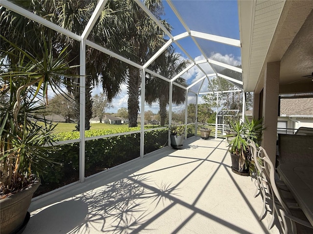 view of patio / terrace with a lanai