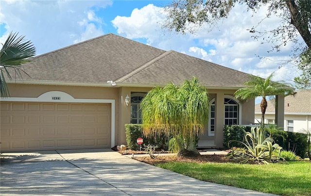 ranch-style house featuring a garage, roof with shingles, driveway, and stucco siding