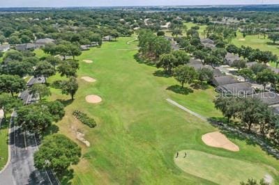 birds eye view of property with view of golf course