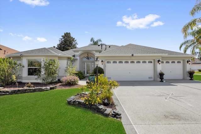 single story home featuring driveway, a front yard, a garage, and stucco siding