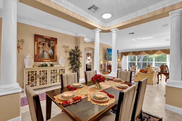 dining space featuring light tile patterned floors, visible vents, and ornate columns