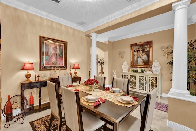 dining area with ornamental molding, decorative columns, and baseboards