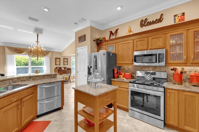 kitchen featuring crown molding, appliances with stainless steel finishes, visible vents, and tasteful backsplash