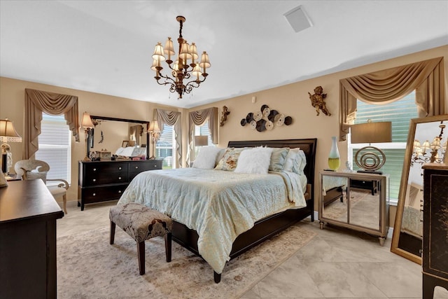 bedroom with a notable chandelier