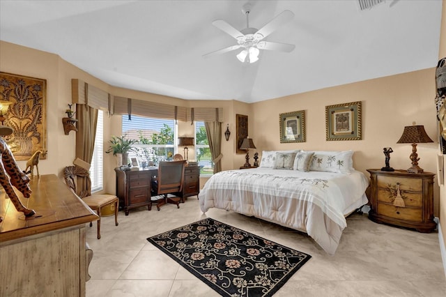 bedroom featuring light tile patterned floors, visible vents, vaulted ceiling, and a ceiling fan