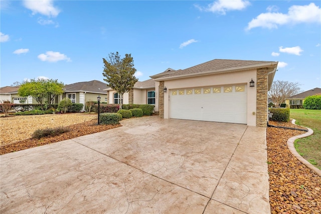 single story home featuring concrete driveway, stone siding, an attached garage, and stucco siding