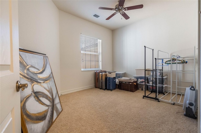 workout area with a ceiling fan, baseboards, visible vents, and carpet flooring