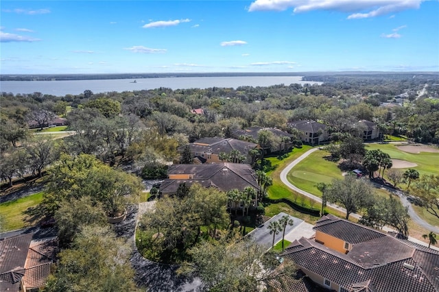 bird's eye view featuring view of golf course and a water view