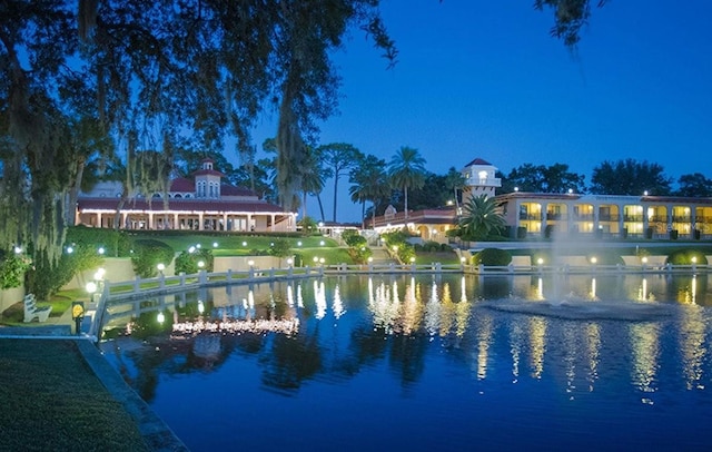 view of pool featuring a water view