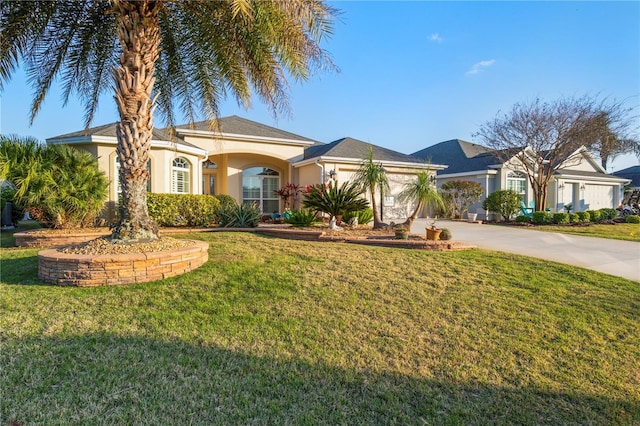 view of front of property featuring stucco siding, a garage, concrete driveway, and a front lawn