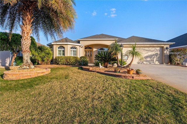 view of front of home with a front lawn, a garage, driveway, and stucco siding