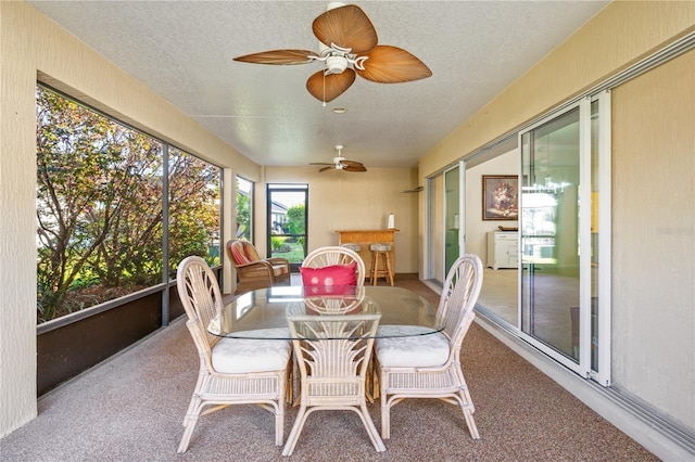 sunroom / solarium with ceiling fan