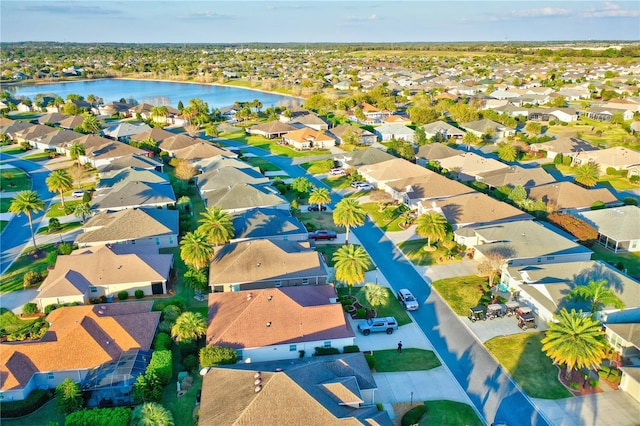 aerial view with a residential view and a water view