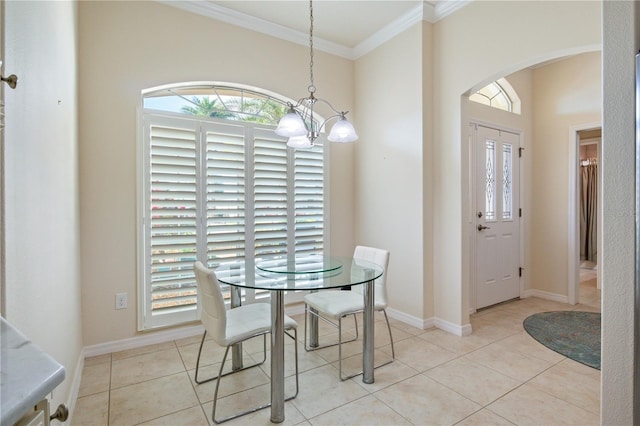 3144 Mayflower Loop, The Villages, FL 32163 - tiled dining room featuring baseboards, arched walkways, an inviting chandelier, and crown molding