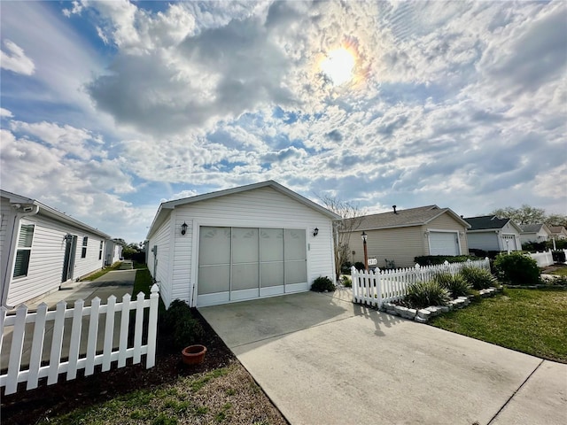 view of front of property with an outdoor structure and fence