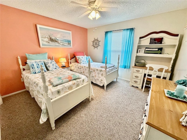 bedroom featuring a textured ceiling, carpet floors, and a ceiling fan