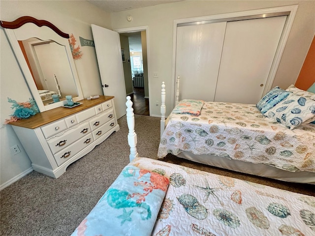 bedroom featuring carpet floors, a closet, and baseboards