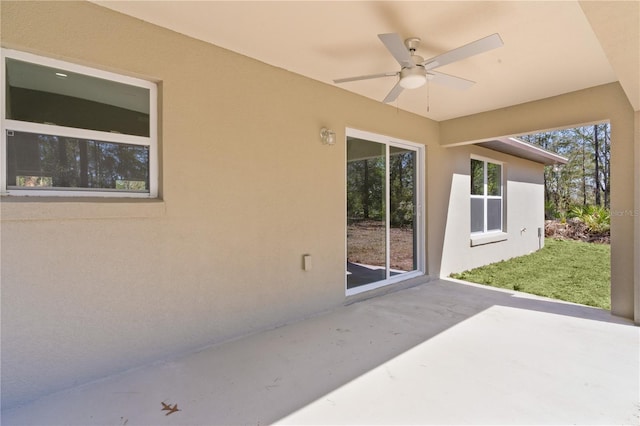 view of patio / terrace featuring ceiling fan