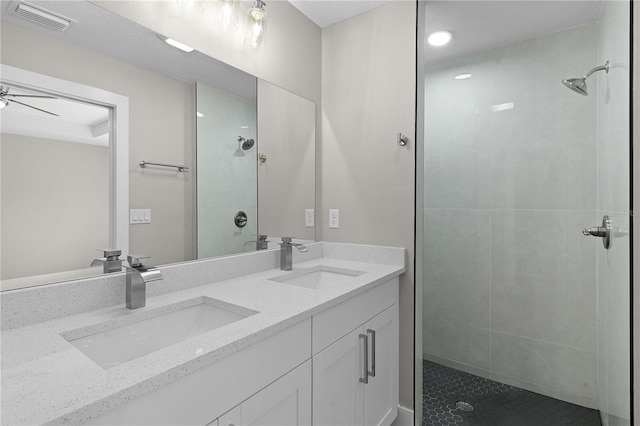 full bath with a stall shower, visible vents, and a sink