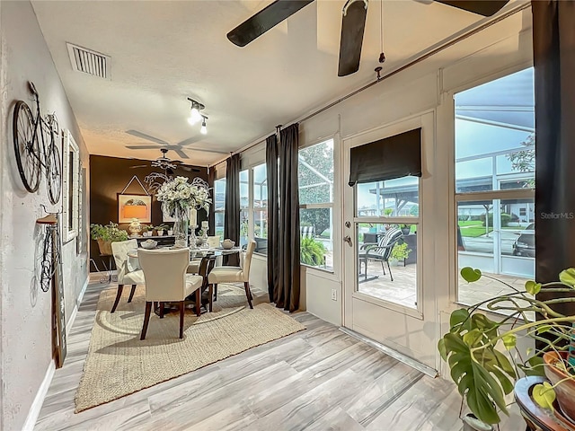 sunroom featuring visible vents