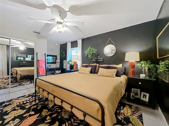 bedroom featuring ceiling fan and visible vents