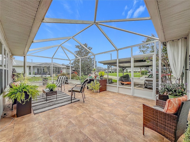 view of patio / terrace featuring a lanai