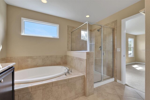 bathroom featuring a garden tub, recessed lighting, a shower stall, vanity, and tile patterned flooring