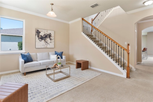 30342 Gidran Ter, Mount Dora, FL 32757 - living area featuring carpet flooring, crown molding, visible vents, baseboards, and arched walkways