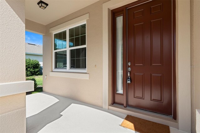 30342 Gidran Ter, Mount Dora, FL 32757 - entrance to property with covered porch and stucco siding
