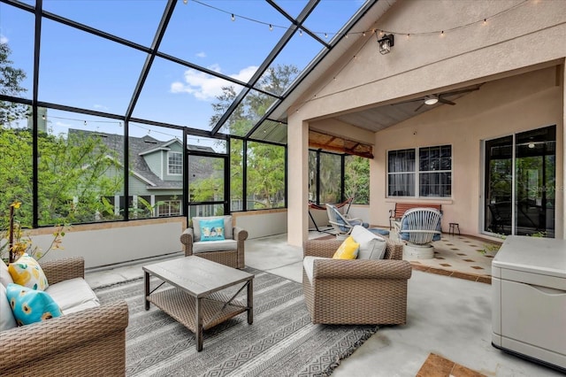 sunroom with a ceiling fan and vaulted ceiling