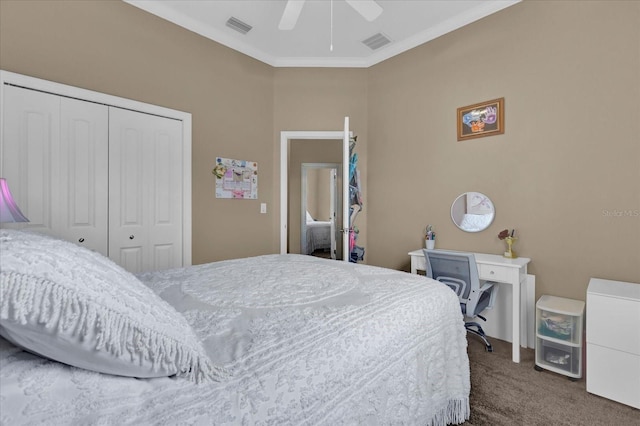 bedroom with carpet floors, crown molding, visible vents, and a closet