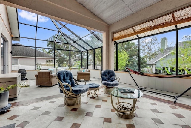 view of patio / terrace featuring an outdoor hangout area and glass enclosure