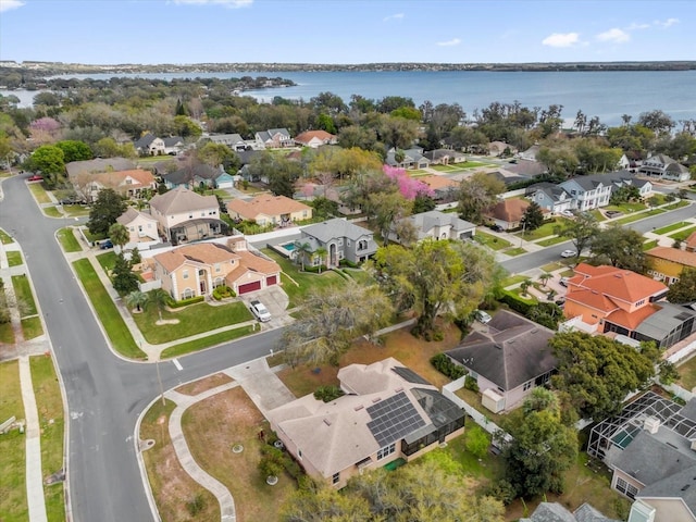 birds eye view of property featuring a residential view and a water view