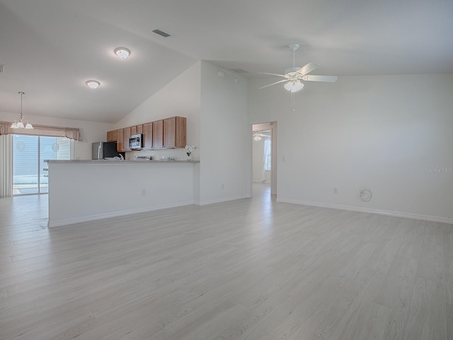 unfurnished living room featuring light wood-type flooring, ceiling fan, visible vents, and baseboards