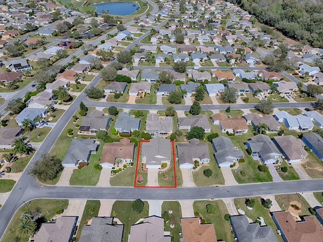 aerial view with a residential view and a water view