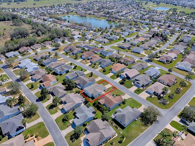 aerial view featuring a water view and a residential view