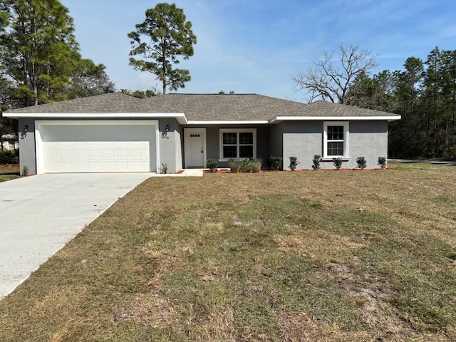 single story home with a garage, driveway, a front yard, and stucco siding