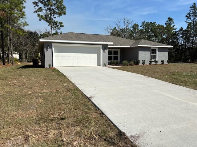 ranch-style house with an attached garage, a shingled roof, concrete driveway, stucco siding, and a front lawn