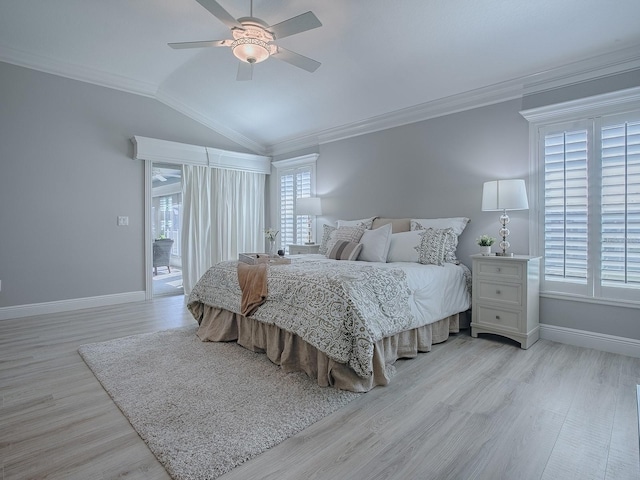 bedroom with vaulted ceiling, ornamental molding, light wood-style flooring, and baseboards