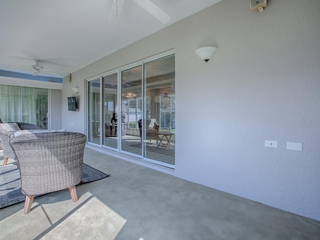 view of patio featuring ceiling fan