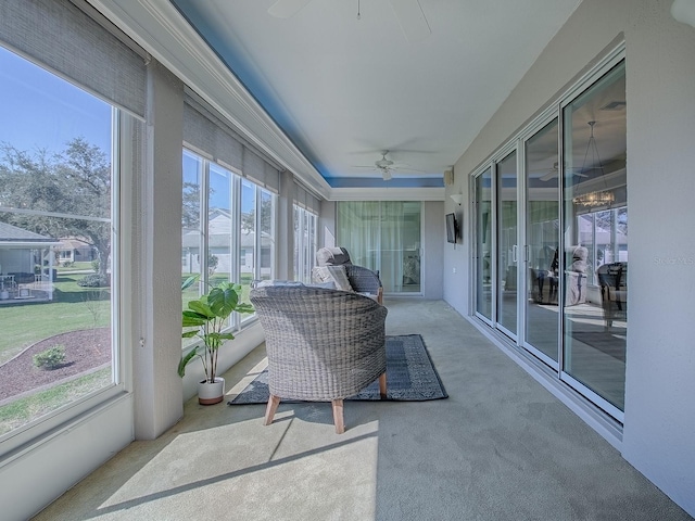 sunroom featuring plenty of natural light and ceiling fan